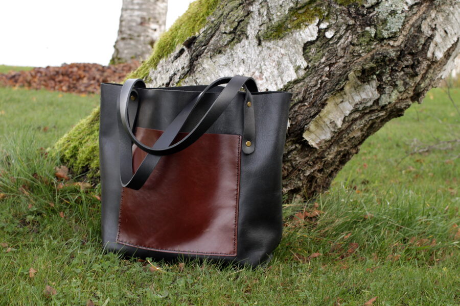 Black leather tote with outside pocket